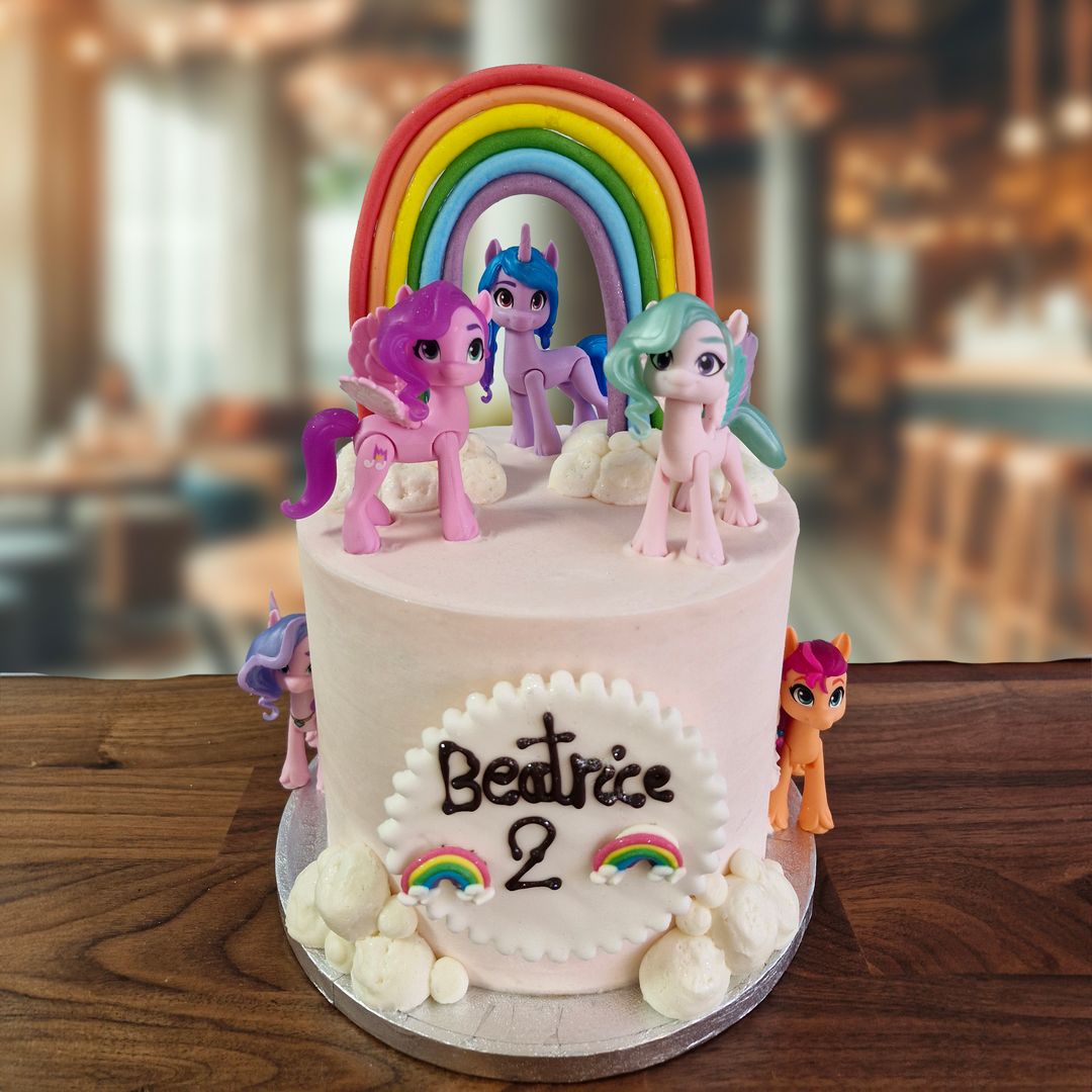 My little pony themed cake with model ponies