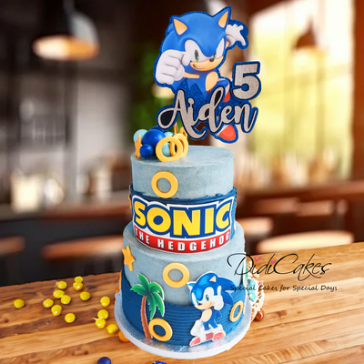 Two tier Sonic cake featuring Sonic rings and logo