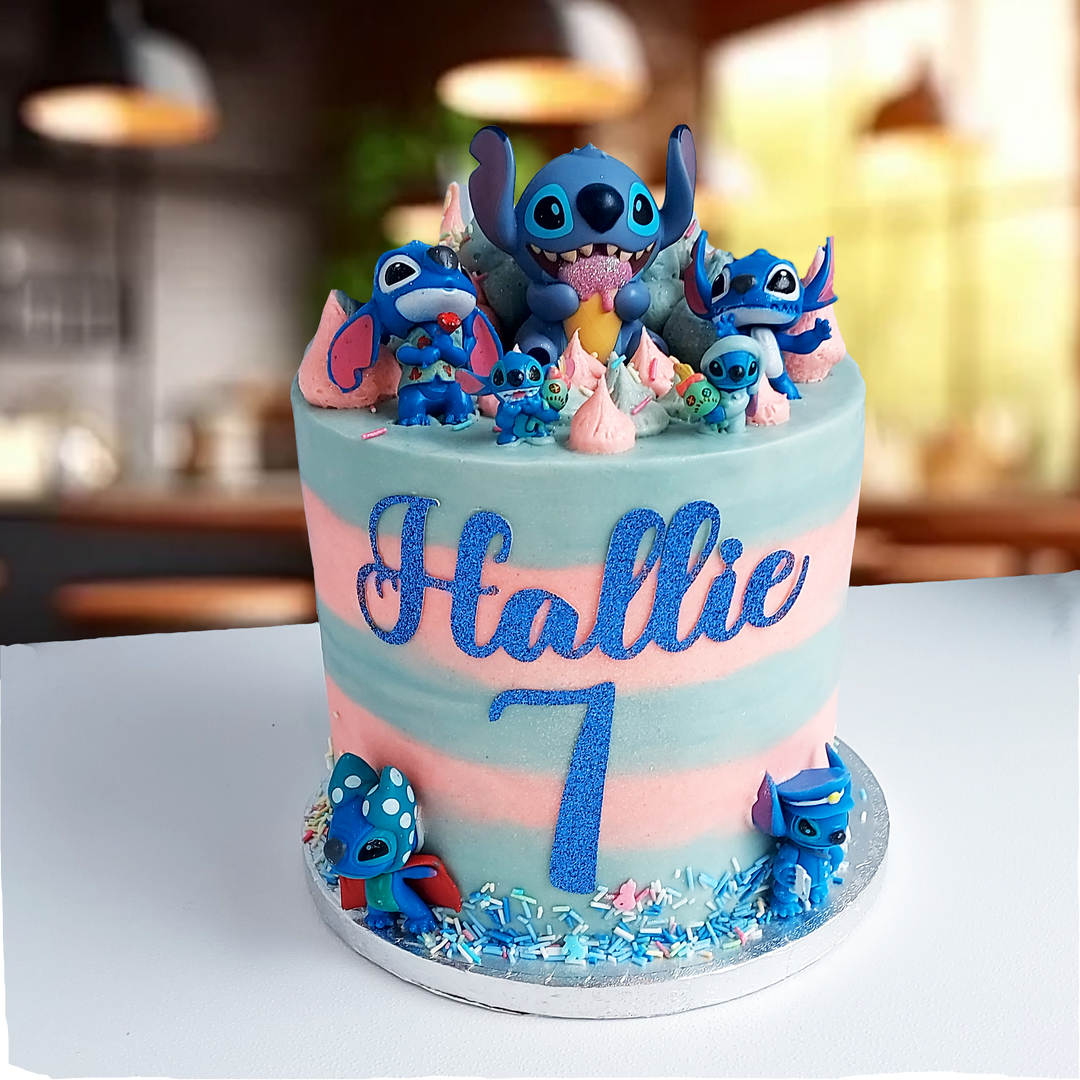 A colorful birthday cake decorated with characters from Lilo and Stitch, personalised with name and ge