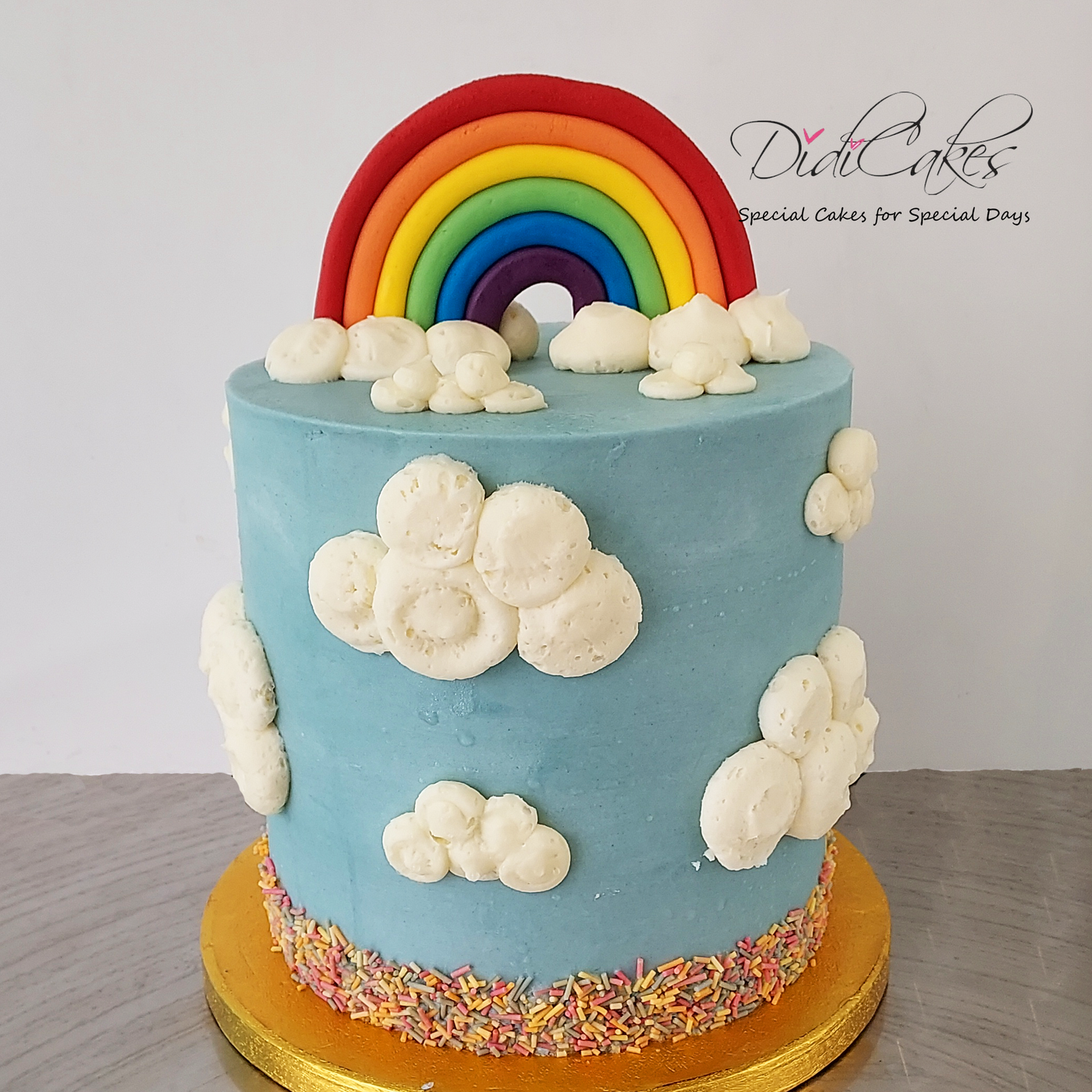 unicorn, clouds and rainbows cake
